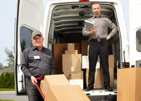 Furniture removals team handling a sofa move in an Islington flat