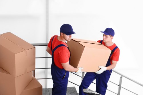 Removal van and moving team in an Islington street setting