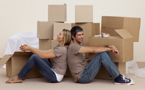 Staff using lifting techniques during a moving job
