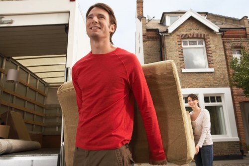 Local team removing a sofa from a flat in Islington