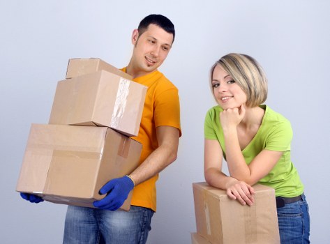 Local office movers navigating a narrow Islington building access point