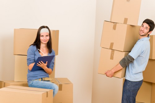 Careful loading of household items for an Islington collection