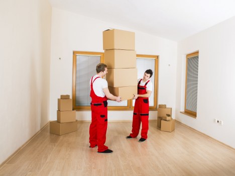 Packed boxes and furniture ready for apartment relocation